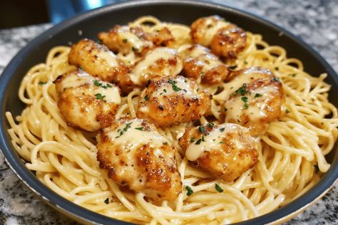 Whip up Garlic Butter Chicken Bites with Creamy Parmesan Pasta in 30 minutes! A savory, family-friendly dish perfect for weeknight dinners. Family Friendly Dinner Ideas, Golden Garlic Chicken Bites Over Creamy Parmesan Pasta, Butter And Garlic Pasta, Husband Dinner Ideas, Garlic Butter Chicken Bites With Creamy Parmesan Pasta, Garlic Butter Chicken Pasta, Butter Chicken Pasta, Creamy Parmesan Pasta, Chicken Breast Dinner Ideas