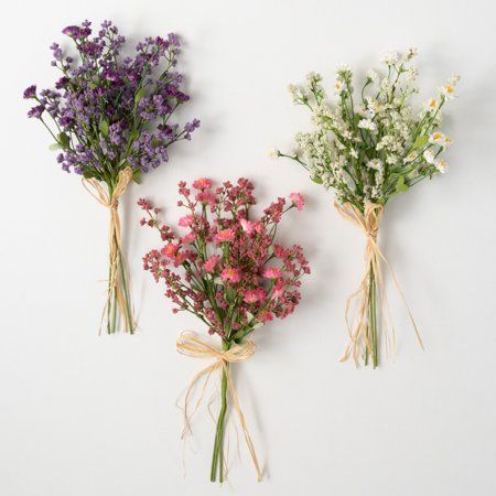 This trio of bushes, each tied off with raffia into handheld bundles, casts a color each on its own. One bright pink, one vibrantly violet, and another in a soft creamy ecru shade - this savvy selection provides a look that feels freshly picked from a wildflower field. Over the last 55 years, Sullivans has become an industry leader in home decorations. Our brand is rooted in tradition while incorporating modernized trends to keep your home looking up to date with timeless style. Here at Sullivan Flowering Bushes, Bridal Shower Balloons, Wildflower Baby Shower, Wildflower Field, Silk Plants, Wildflower Bouquet, Pillows Flowers, Freshly Picked, Project Runway