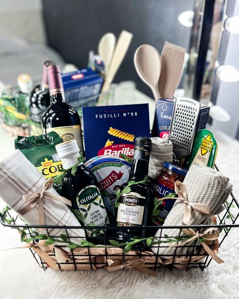 The ultimate gift for pasta enthusiasts! 

This DIY basket includes everything needed for a perfect Italian-inspired meal: gourmet pasta, rich sauces, olive oil, a block of Parmesan with a handy Parmesan grater. 
To make it look truly special, add some wooden spoons, a stylish pasta strainer, and a bottle of bold red wine to top it all off. 
Add some bows and decorations for richer effect. 

Thoughtful, delicious, and beautifully arranged—this gift basket is perfect for foodies, home cooks, and anyone who loves authentic flavors and cozy dinners! 

#PastaLovers
#DIYGiftBasket
#ItalianCuisine
#GourmetGifts
#FoodieGifts
#foodgift Pasta Gift Basket Ideas, Pasta Gift Basket, Pasta Gifts, Diy Gift Basket, Gourmet Pasta, Pasta Strainer, Cozy Dinners, Diy Gift Baskets, Creative Diy Gifts