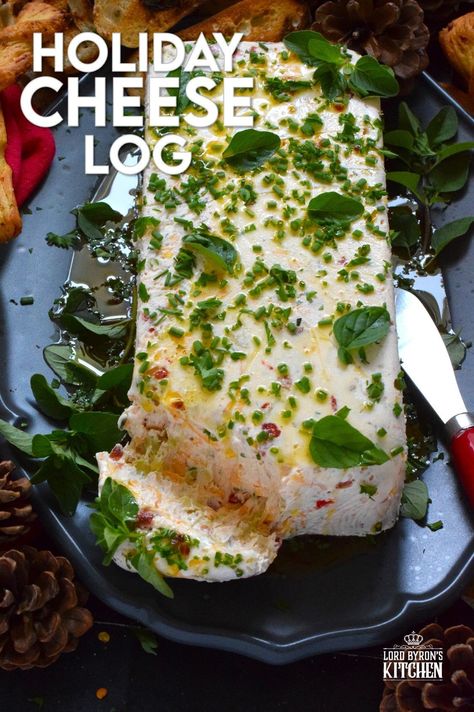 This Holiday Cheese Log is packed with a tonne of flavourful add-ins, such as chili flakes, roasted red peppers, sun-dried tomatoes, and fresh chives. Seasoned with garlic, onion, basil, oregano, and more, this holiday appetizer is a tremendously delicious party favourite! #cheeselog #appetizer #holiday #christmas Christmas Cheese Log, Italian Cheese Log, Cheese Logs, I Like Cheese, Most Pinned Recipes, Awesome Appetizers, Holiday Cheese, Cheese Log, Christmas Buffet