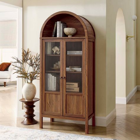 Display your treasures with the stylish design of the Tessa Arched Storage Cabinet. With an impeccable sense of style, this wood cabinet embodies the elegance of vintage aesthetics and is an ideal accent in living rooms, hallways, or dining spaces. Colored Bookshelf, Arched Storage, Arched Design, Dining Room Cabinet, Organization Storage, Cabinet Bed, Wood Bookcase, Tall Cabinet, Storage Display