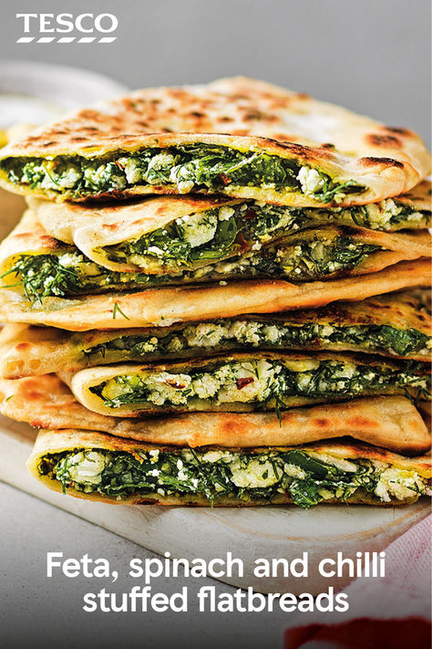 In search of a low-effort lunch? These stuffed flatbreads are just what you need. Filled with crumbled feta, lemony spinach and crushed chillies, they make the speediest (and tastiest) meal. | Tesco Spinach Flatbread Recipe, Potato Stuffed Flatbread, Spinach Feta Flatbread, Zaatar Flatbread, Feta Spring Flatbread, Stuffed Flatbread, Lunch Stuff, Bread Head, Curry Recipes Vegetarian