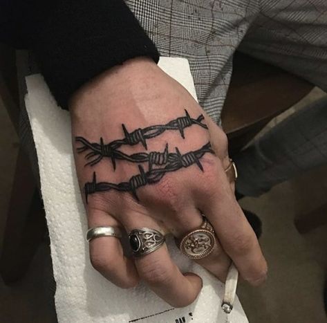 Barbed wire tattoo on the right hand Barbed Wire Tattoo, Wire Tattoo, Traditional Hand Tattoo, Simple Hand Tattoos, Side Hand Tattoos, Barbed Wire Tattoos, Tattoo On Wrist, Skull Hand Tattoo, Knuckle Tattoos