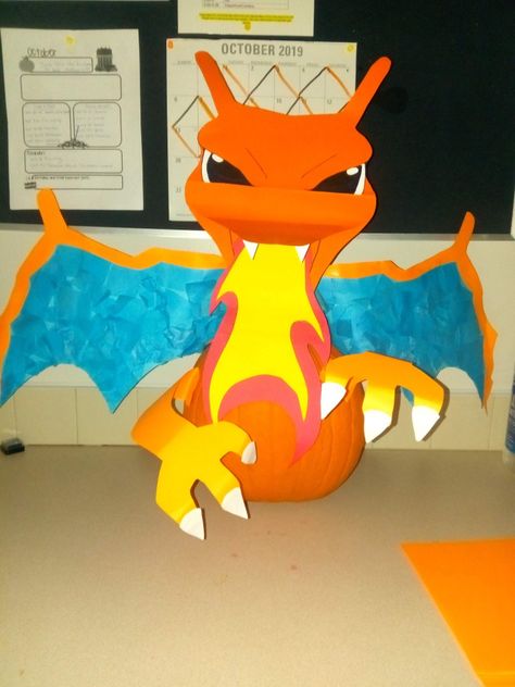 Pokemon Pumpkin Decorating Ideas, Charizard Pumpkin Painting, Charizard Pumpkin, Charmander Pumpkin, Dragon Pumpkin, Storybook Pumpkin, Pokemon Pumpkin, Book Character Pumpkins, Story Book Pumpkin