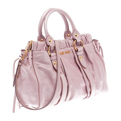 TOP HANDLE    Shiny calf top handle bag with laces on front  Gathering on top part and laces on sides  Polished brass hardware  Detachable shoulder strap  Snap closure  Inside pocket with zipper  Metal lettering logo on outside  Cotton satin lining  Strap length: 98 cm    L13.8" H8.7" D4.7"