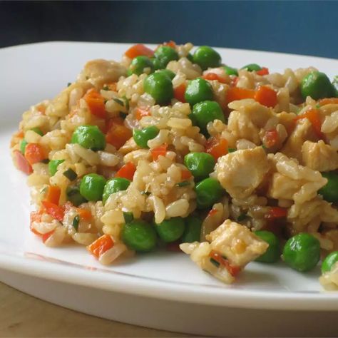 Garlic Chicken Fried Brown Rice Recipe | Allrecipes Rice With Peppers And Onions, Chicken Fried Brown Rice, Rice With Peppers, Leftover Brown Rice, Garlic Chicken Stir Fry, Chicken Fried Rice Recipe, Fried Brown Rice, Dried Parsley, Brown Rice Recipes