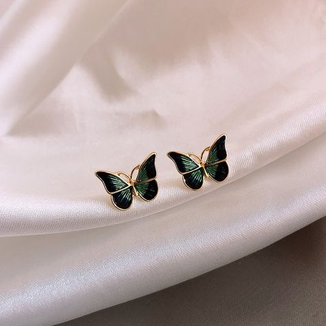 Flutter into elegance with our Dainty Green Butterfly Stud Earrings! These enchanting studs capture the delicate beauty of butterflies with their graceful design and vibrant green hue. Handcrafted with precision and love, these earrings are perfect for adding a touch of whimsy to any outfit. Whether you're dressing up for a special occasion or adding a playful accent to your everyday look, these Dainty Green Butterfly Stud Earrings are sure to delight. Minimal Earrings Studs, French Green, Butterfly Stud Earrings, Butterfly Earrings Stud, Green Butterfly, Animal Earrings, Stud Jewelry, Small Earrings Studs, Butterfly Jewelry