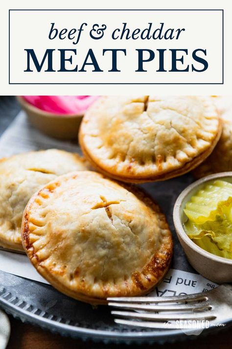 These easy meat pies include tender, buttery, flaky pastry dough wrapped around a flavorful ground beef, cheddar, and caramelized onion filling. Thanks to a couple of shortcuts, the convenient savory hand pies come together quickly and can be assembled in advance for busy weeknights! Easy Meat Pies, Savory Hand Pies Recipes, Savory Hand Pies, Beef And Cheddar, Hand Pies Savory, Beef Pot Pies, Meat Pie Recipe, Beef Pies, Hand Pie Recipes