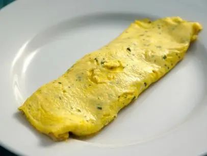 French Omelette with Fines Herbes Recipe | Michael Symon | Food Network Cavatelli Recipe, Breakfast In The Garden, Omelette Recipes, French Omelette, Omelets Recipe, Michael Symon, Lemon Twist, Omelette Recipe, Best Oven