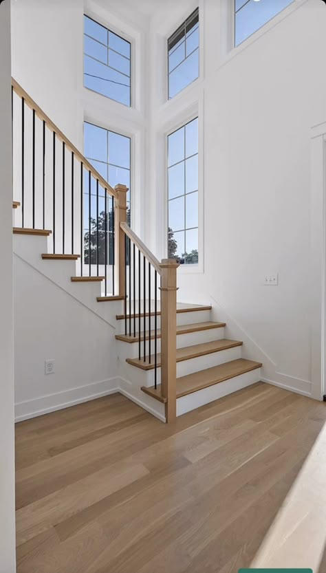 3 Floor Staircase, Stairs Over Doorway, Split Landing Staircase, Open U Shaped Staircase, Transitional Modern Staircase, Where To Put Stairs In A House, L Shaped Staircase Foyer Entryway, Two Toned Staircase, Stairway Window Ideas