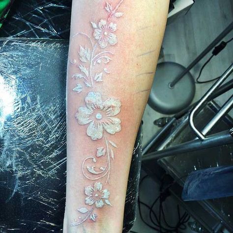 Beautiful white inked flower along the arm by Antaolii Art | www.otziapp.com White Lace Tattoo, White Ink Flower Tattoo, White Floral Tattoo, White Ink Tattoos Healed, White Flower Tattoo, White Flower Tattoos, Black And White Flower Tattoo, Lines Tattoo, Heather Flower