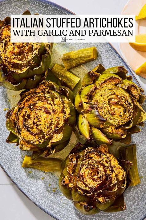 Stuffed artichokes with parmesan cheese, garlic, parsley and crispy breadcrumbs. Make this easy stuffed artichoke recipe for a show-stopping vegetarian main or as a restaurant-worthy side dish. Stuffed Artichokes, Baked Greek Chicken, Spring Salad Recipes, Roasted Artichoke, The Mediterranean Dish, Mediterranean Kitchen, Artichoke Recipes, Spinach Recipes, Mediterranean Dishes