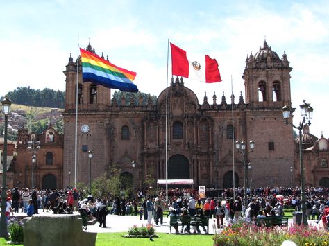 Cuzco and Peru flag in public square Peru Flag, Gap Year Travel, City Flags, Altitude Sickness, Public Square, Andes Mountains, Peru Travel, Gap Year, Rainbow Design