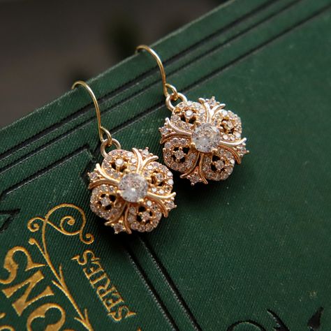 Beautifully sparkly 18k gold plated dangle and drop earrings in a Regency / Victorian style with perfectly shaped round faceted cubic zirconia stones. The drops measure 1.5cm (0.6") in length. Perfect wear for any occasion or to give as a special, thoughtful gift. Your earrings will arrive to you in gift box ready to give or to treat yourself. These earrings are perfect for a bride or bridesmaids for a classic or vintage themed wedding. If you would like a larger quantity, please DM us or email 1930 Jewelry, Vintage Earrings Victorian, Victorian Gold Earrings, Regency Jewelry, Earrings Zirconia, Art Nouveau Earrings, Vintage Gold Earrings, Art Nouveau Earring, Classy Earrings