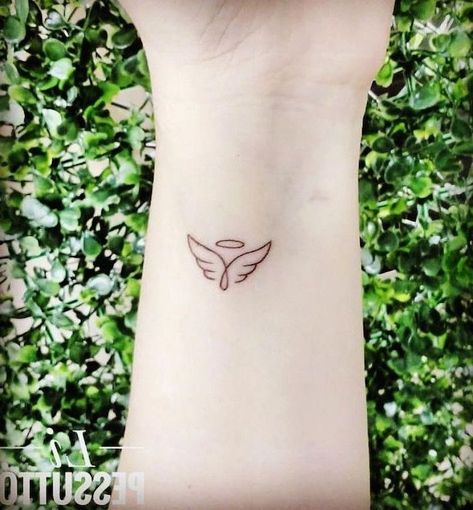 small-angel-wings-tattoo-wrist-tattoo-green-bushes-in-the-background Small Angel Wing Tattoo, Tattoos For Women Small Meaningful, Tattoo Angel, Tattoo Family, Angel Tattoos, Female Tattoos, Knight Templar, Shape Tattoo, Meaningful Tattoos For Women