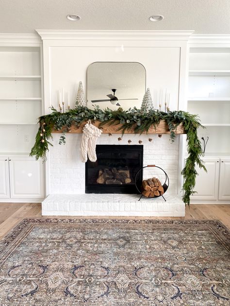 Tile Fireplace Ideas, Garland On Mantle, Boho Christmas Decor Ideas, White Brick Fireplace, Boho Christmas Decor, Christmas Boho, Fireplace Mantle Decor, Dollar Eucalyptus, Cozy Christmas Decor