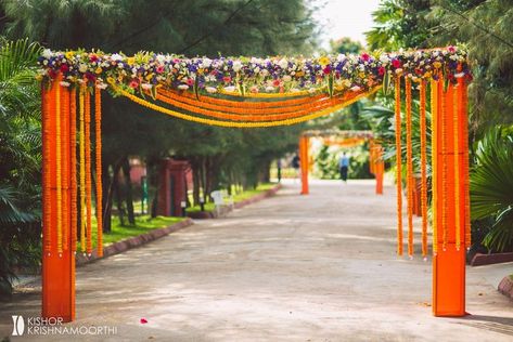 Photo By Eventology  - Decor Haldi Entrance, Walkway Decor, Wedding Decorations Pictures, Mehendi Decor Ideas, Name Board, Gate Decoration, Reception Backdrop, Delhi Wedding, Wedding Entrance Decor