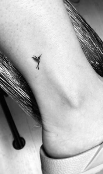 Tiny Bird Tattoos For Women Finger, Tiny Tattoos Hummingbird, Small Hummingbird Tattoo Ankle, Microrealism Hummingbird Tattoo, Micro Memorial Tattoo, Hummingbird Tattoo Finger, Micro Tattoo Hummingbird, Dainty Peacock Tattoo, Tiny Hummingbird Tattoos