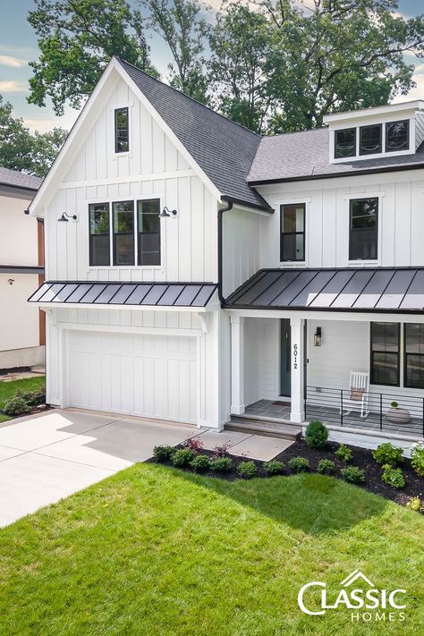 An exterior image of a white modern farmhouse of board and batten, half porch, black iron rails. Flagstone Front Porch, Barn Style Garage, Hardy Plank Siding, Farmhouse Craftsman, Spec Home, Hardie Board, Board And Batten Exterior, Farmhouse Exterior Design, Board Batten