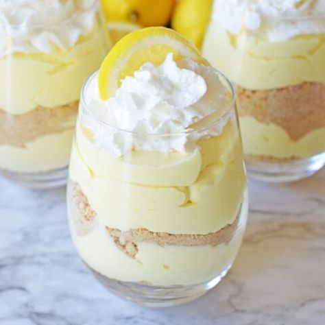 Lemon Cheesecake Parfait - Fun Money Mom Best Lemon Cheesecake, Cheesecake Parfait Recipes, Easy Lemon Cheesecake, Cheesecake Parfait, Parfait Recipe, Cheesecake Parfaits, Mini Dessert Cups, Parfait Desserts, Cheesecake Cups