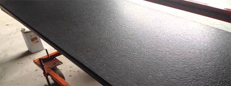 A slab of black leathered granite Black Leathered Granite Countertops, Black Granite Kitchen Countertops, Leathered Granite Countertops, Leathered Granite, White Granite Slabs, Black Granite Kitchen, Granite Monuments, Granite Blocks, Leather Granite