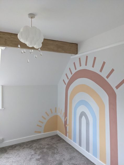 A relaxed, neutral coloured rainbow wall mural for nursery. Muted Rainbow Wall Mural, Neutral Rainbow Playroom, Boho Rainbow Bedroom Decor, Muted Rainbow Playroom, Paint Rainbow On Wall, Nursing Room Ideas, Boho Rainbow Wall Mural, Muted Rainbow Nursery, Rainbow Boys Room