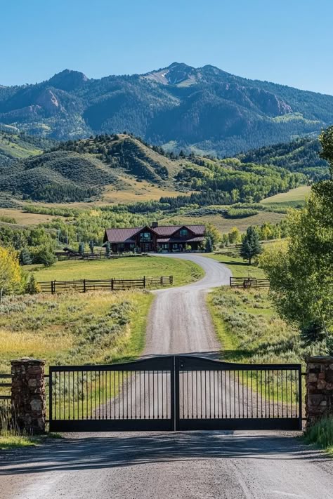 Traditional ranch entrance direway mountain road large gate ranch house at the end of driveway. Discover the charm, practicality, and unique features of ranch houses in this stunning collection of designs and ideas. Houses On Acreage, Country Dream House Ranch Style, Long Drive Way Entrance, Ranch In Colorado, Farm And Ranch Real Estate, 4 Acres Of Land Ideas, Ranch In The Mountains, Ranch Fences And Gates, Rancher House Exterior