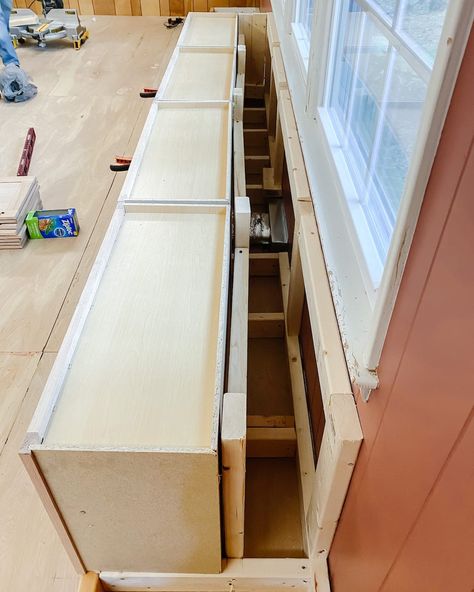 A step-by-step tutorial to build DIY built in cabinets and a window seat using inexpensive stock kitchen cabinets. Wall Cabinet Bench, Window Seats In Kitchen, How To Build A Window Seat, Diy Built Ins Around Window, Window Built Ins With Bench, Dining Room Built Ins Around Window, Window Seat In Kitchen, Diy Window Seat With Storage, Built In Window Bench