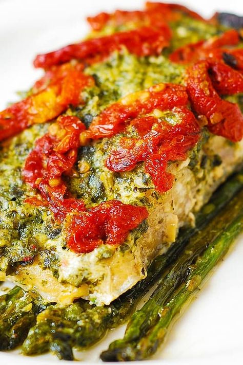 Jump to Recipe Print RecipeBasil Pesto Sea Bass and Veggies (Asparagus and Sun-Dried Tomatoes) baked in foil – delicious, easy, 4-ingredient, 30-minute recipe.  Mediterranean fish baked the right way!  Low-carb, gluten free recipe. Baked sea bass with asparagus and basil pesto is a perfect Summer dinner!  It’s light, uses lots of vegetables, yet it will...Read More Salt Baked Fish, Nutritional Foods, Baked Seafood, Baked Sea Bass, Italian Fish, Mediterranean Fish, Pacific Cod, Haddock Recipes, Fish Meals