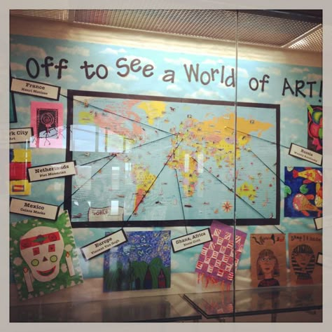 art around the world.  I'd love to change this to "Off to See a World of Music" and highlight unusual instruments from various countries. Art Show Themes Elementary, Artist Of The Month Bulletin Board, Unusual Instruments, Travel Classroom, Art Around The World, Art Room Doors, Travel Theme Classroom, Multicultural Art, Art Room Posters