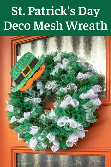 This St. Patrick’s Day deco mesh wreath is perfect for your front door! It’s easy to make, and you’ll love the leprechaun hat and mustache. Diy St Patricks Day Wreath, Diy St Patrick's Day Crafts, St Patrick's Day Drinks, Holiday Wreath Ideas, St Patrick's Day Desserts, St Patrick's Day Printables, Diy Deco Mesh Wreath, Wreaths St Patricks, Girls Night Crafts