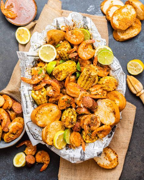 This Low Country Boil recipe is loaded with fresh shrimp, smoky sausage, sweet corn, and tender potatoes. Perfect meal for the family! Country Boil Recipe, Low Country Boil Recipe, Low Country Boil Party, Cooked Shrimp Recipes, Homemade Cocktail Sauce, Louisiana Seafood, Country Boil, Low Country Boil, Fresh Shrimp