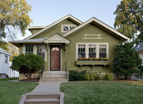 Green Cottage Exterior Paint, Brown Home Exterior Paint, Green Home Outside, Yellow Green Exterior House Colors, Avocado Green Exterior House Colors, Green House Exterior Stucco, Green Painted Exterior House, Cottage Paint Colors Exterior Colour Schemes, 1930s House Exterior Paint Colors