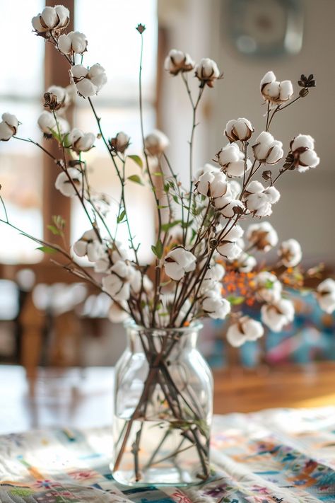 Discover how to bring a cozy farmhouse touch to your special day with this rustic wedding centerpiece idea 💒🌿. A quilt square adds vintage allure under a vase of fluffy cotton stems and aromatic herbs, perfect for a heartfelt homestead-themed celebration. #WeddingInspiration #RusticWedding #FarmhouseChic #WeddingCenterpiece #VintageDecor #HerbalTouches #CountryWedding #HomesteadVibes Craft a scene of nostalgia and natural beauty for your tablescape! Cotton Centerpiece, Wedding Table Centerpieces Rustic, Table Decorations Wedding, Embrace Natural Beauty, Cotton Stems, Rustic Wedding Table, Centerpiece Table, Mens Birthday Party, Quilt Square