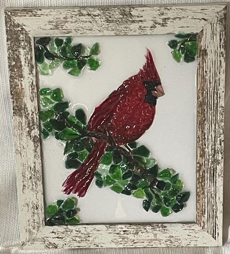 Handcrafted Glass Art Red Cardinal on Rustic Weathered Wood Frame Hand crushed glass Red Cardinal sitting on branch.   Resin added to make the piece  sparkle and for protection. *Made to order.  You will receive similar glass art piece of a cardinal with white frame.  *The white back is removeable to display with clear glass as a shelf sitter.   *Or leave the white back on, which has metal hanger, to hang on a wall. Size:  10 wide x 12 tall x 1 deep ~  ~   ~   ~ *IF YOU WANT TO PICK UP LOCALLY  PLEASE CONTACT ME BEFORE PURCHASING ON ETSY Local pick in Bloomingdale, Illinois or Algonquin, Illinois  ~  ~  ~  ~ I am a glass artist who enjoys creating various forms of art with crushed, clipped, fused, blown, and stained glass. I teach classes and have 2 booths where I sell my art pieces. Fused Glass Cardinal Pattern, Framed Resin Art, Fused Glass Cardinal, Christmas Resin Art, Shattered Glass Art, Shard Art, Glass Resin Art, Painted Window Art, Broken Glass Crafts