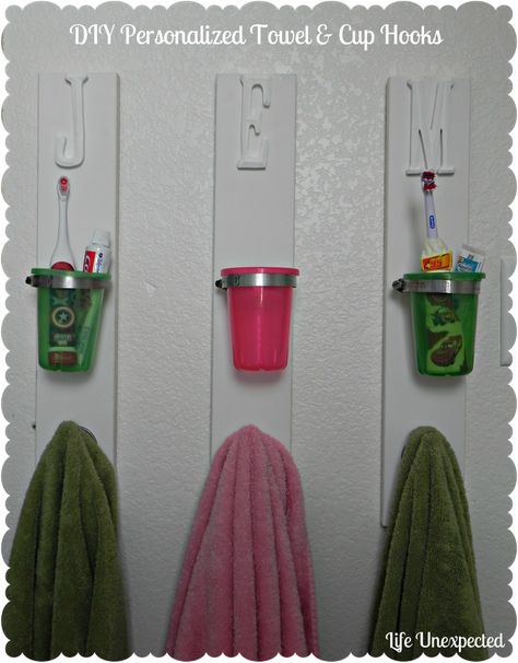 DIY Towel Hook with Toothbrush/toothpaste cup. Perfect! Each kid has a place for their necessities and you can WASH those cups out so they don't get nasty :) Diy Towel Hooks, Diy Toothbrush Holder, Diy Toothbrush, Modern Bathroom Interior, Diy Towels, Brush Teeth Kids, Bathroom Organization Diy, Toothbrush Holders, Bathroom Decor Ideas Colors