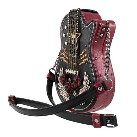 Rock out with this eye-catching guitar shaped handbag that is essential for any future rockstar! This beaded handbag with vegan leather and chain crossbody strap can be used to carry all your essentials with a playful and peppy sense of style. Along with an inside pocket for easy access, this product has a magnetic closure to keep your wallet, cell phone, keys, and more safer than ever. 7 x 2 x 9.5" Strap Length End to End: 46.5" Strap Drop: 21" Non-removable vegan-leather and chain crossbody st Funky Purses, Punk Fashion Diy, Lizzie Hearts, Handbag Boutique, Unique Backpacks, Guitar Bag, Mary Frances, Beaded Handbag, Pretty Bags