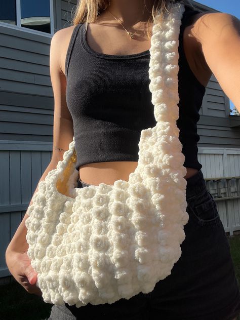 over the shoulder crochet bag using the popcorn stitch. perfect for cozy fall weather made with weight 6 bernat blanket yarn #crochet #crocheting #crochetbag #tutorial #crochettotebag #tutorial #aesthetic #popcornstitch #bubblestitch Crochet Bernat Yarn, Crochet Puffy Bag, Bobble Bag Crochet, Popcorn Stitch Crochet Bag, Bubble Stitch Crochet Bag, Aesthetic Crochet Bag Ideas, Crochet Shoulder Bags Aesthetic, Cute Crochet Bag Aesthetic, Chenille Crochet Bag