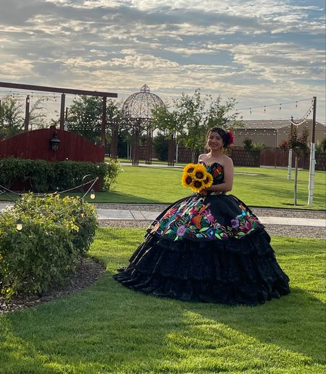 #mexican #quinceañera #quince Quince Mexican Theme Dress, Folklorico Quinceanera Dress, Coco Quinceanera Theme, Book Of Life Quinceanera, Quensenara Ideas, Black Quince Dresses Mexican, Quncie Dresses Mexican, 15 Dresses Quinceanera Mexican Black With Flowers, Quncie Dresses Charro