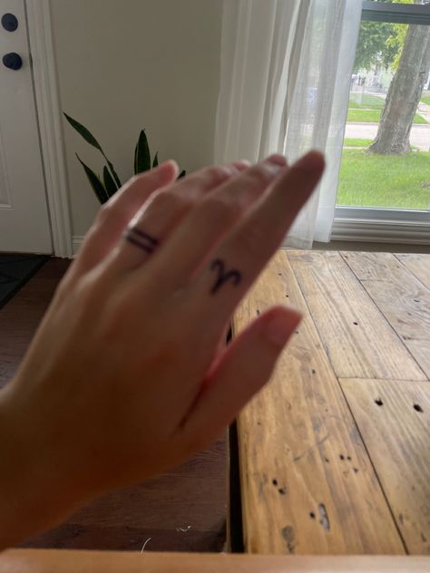 Wedding band and simple aries symbol Aries Tattoo Finger, Aries Finger Tattoo, Dainty Finger Tattoos, Aries Symbol, Zodiac Aesthetic, Finger Tats, Aries Tattoo, Cute Tattoo, Tattoo Feminina