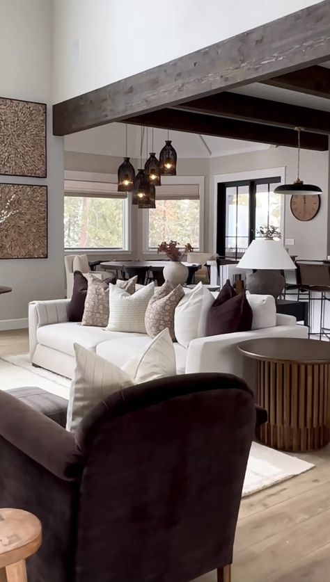 Dark Wood Beams Living Room, Dark Brown House Aesthetic, Dark Beams Living Room, Moody Dark Living Room With A Dark Brown Sectional Sofa, Wood Beams Living Room, Dark Beams, Osbourne House, Brown Velvet Sectional, Dark Brown Leather Sectional