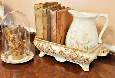 Brown transferware. Cups stacked under a cloche, pitcher and books in a rectangular bowl. Antique Booth Displays, Antique Booth Ideas, Dish Display, Vintage Vignettes, Living Vintage, Interior Vintage, Brown Transferware, Antique Dishes, Vintage Display