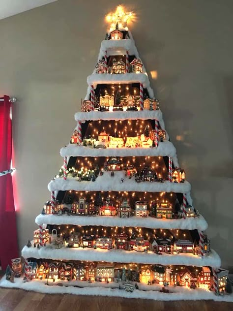 Wall Christmas Village Tree #Christmas #trees #decorhomeideas How To Make Christmas Village Tree Display, Christmas Tree For Village Houses, How To Store Christmas Village Houses, Christmas Tree Display For Village, Christmas Display Shelf, Department 56 Christmas Village Display, Display For Christmas Village, Christmas Tree Placement In Living Room, Christmas Village Stand