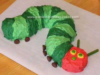 Coolest Very Hungry Caterpillar Cake using bundt cake, a loaf cake, Hershey's kisses (eyes), sprees(face), and fruit twists (antennae). Hungry Caterpillar Cake, Caterpillar Cake, Hungry Caterpillar Party, Hungry Caterpillar Birthday, Childrens Birthday Cakes, The Very Hungry Caterpillar, Cool Birthday Cakes, 1st Birthday Cake, Very Hungry Caterpillar