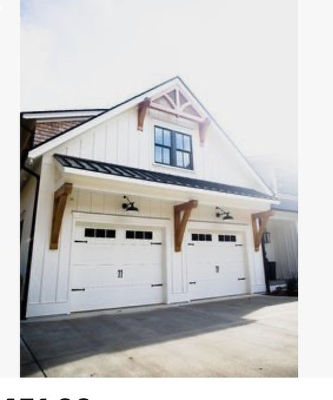 Outdoor Light Above Garage, Decorative Garage Overhang, Awning Above Garage Door, Farmhouse Exterior Lighting Garage, Pergola Over Garage Door Wood, Lights Above Garage Door, White Garage With Wood Doors, White And Black House Exterior With Wood, Garage Awnings Exterior