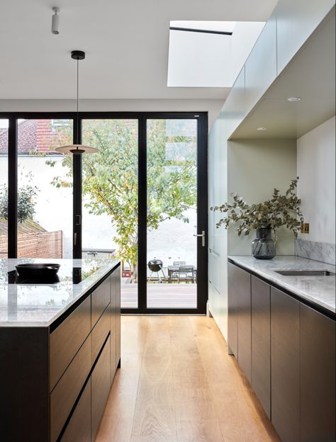 An open plan kitchen with large island and bifold doors Modern Metal Kitchen, Wrap Around Extension, Contemporary Style Kitchen, Glass Extension, Period Property, Kitchen Installation, Scandi Design, Timber Cladding, Elegant Kitchens