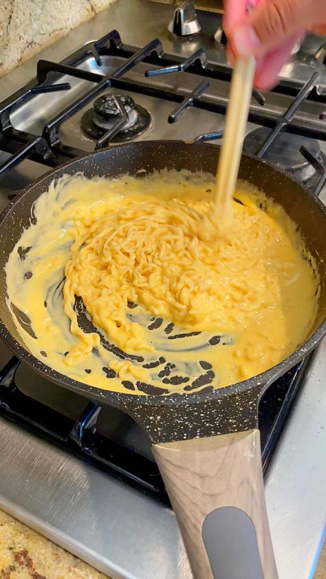 How to Make Cheese Ramen Noodles: TikTok's Favorite Recipe Cheesy Asian Noodles, Ramen Noodles Cheese, Cheesy Ramen Noodles Video, Ramen Noodle Mac And Cheese, Cheesy Samyang Noodles, Cheesy Shin Ramyun, Creamy Roman Noodles, Ramen Recipes Cheese, Noodle Recipes Cheesy