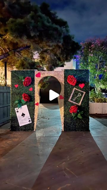 XXL Flowers - Rêve Affair on Instagram: "One of my favorite themes for the event is Alice in Wonderland, Queen of Hearts ❤️♠️♦️♣️ #xxlflowers Specially customized entrance for the party with a big keyhole and XXL flowers! Little Magic is always fun!   #aliceinwonderland #aliceinwonderlandtheme #aliceinwonderlandparty #giantflowers #bigflowers #partyentrence #backdrop #sweet16 #sweet16party #backdropflower #decorideas" Keyhole Alice In Wonderland, Queen Of Hearts Trunk Or Treat Ideas, Alice In Wonderland Arch, Queen Of Hearts Trunk Or Treat, Haunted Alice In Wonderland, Alice And Wonderland Trunk Or Treat, Queen Of Hearts Party Theme, Alice In Wonderland Trunk Or Treat, Queen Of Hearts Garden