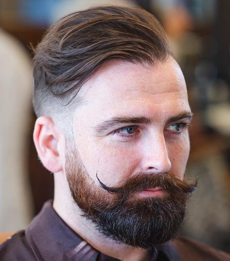 Undercut with Beard and Handlebar Moustache Undercut With Beard, Haircuts For Balding Men, Mens Modern Hairstyles, Balding Mens Hairstyles, Hairstyles For Receding Hairline, Hairstyle App, Handlebar Mustache, Popular Mens Hairstyles, Men With Grey Hair