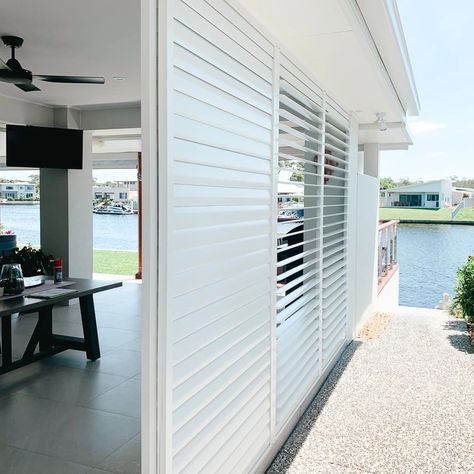 Outdoor Sliding Shutters, External Shutters, Privacy Porch, White And Blue House, Outdoor Window Shutters, Covered Porch Ideas, Bathroom Exterior, Pool Area Ideas, Bahama Shutters